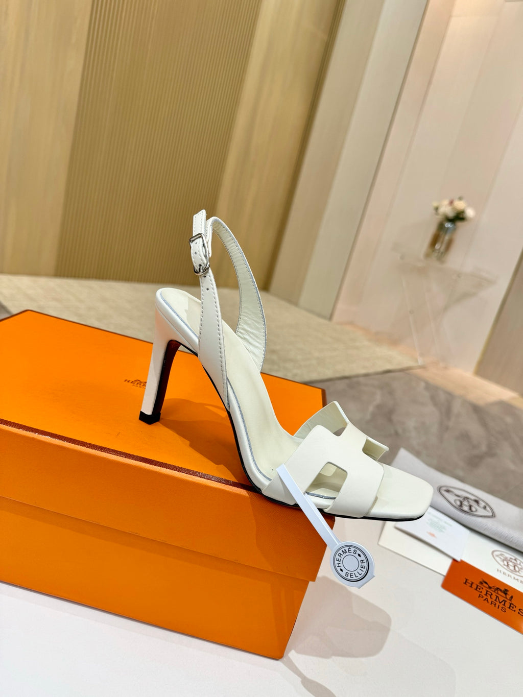 White leather heeled sandal with ankle strap and open toe, stiletto heel