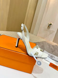 White leather heeled sandal with ankle strap and open toe, stiletto heel