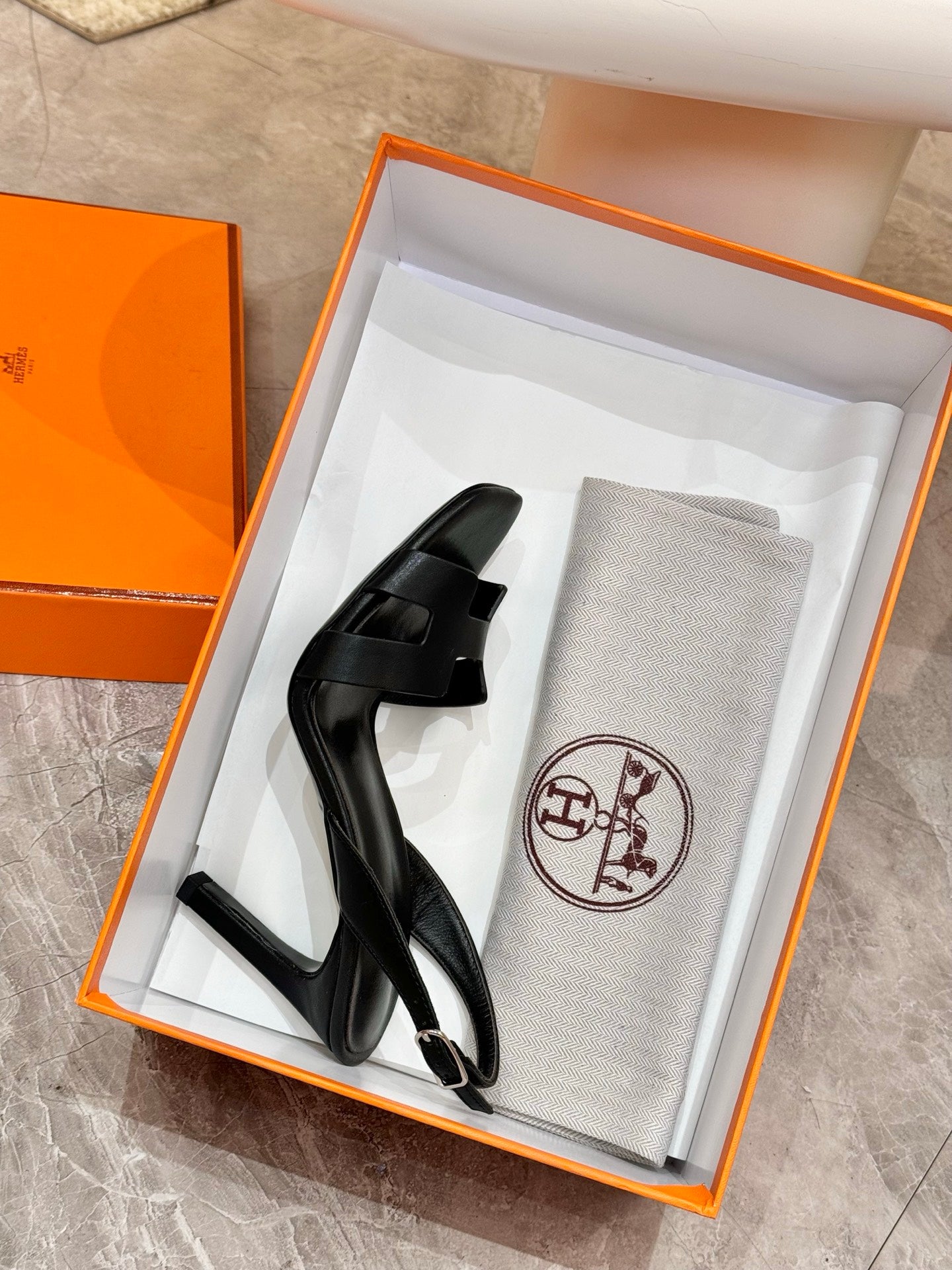 Black slingback heeled sandal with T-strap and adjustable buckle