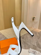 White heeled sandal with ankle strap and side buckle detail