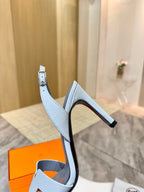 Hermes ladies heeled sandals profile view, light blue with thin ankle strap