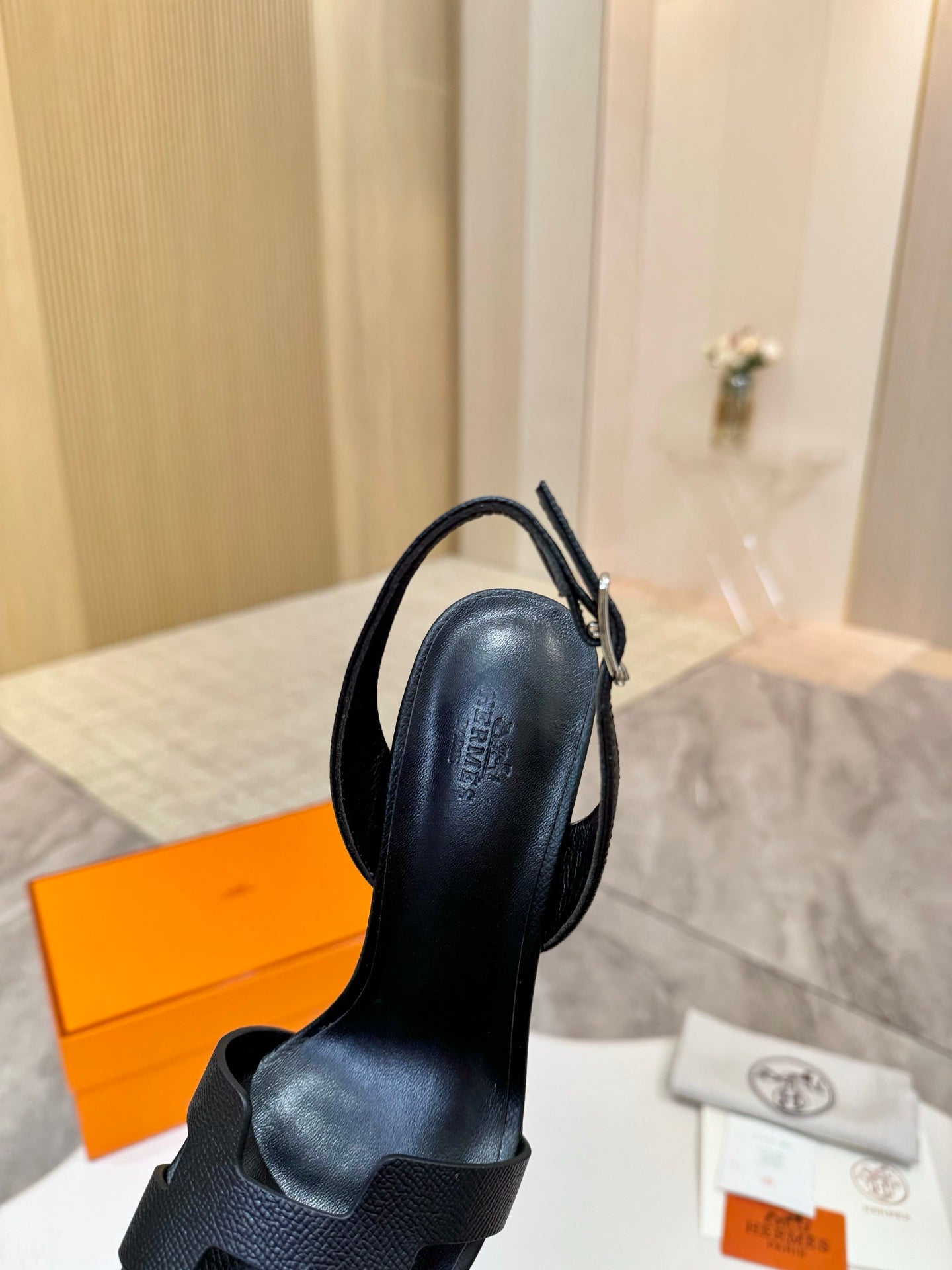 Hermes black heeled slingback sandals, side view with ankle strap