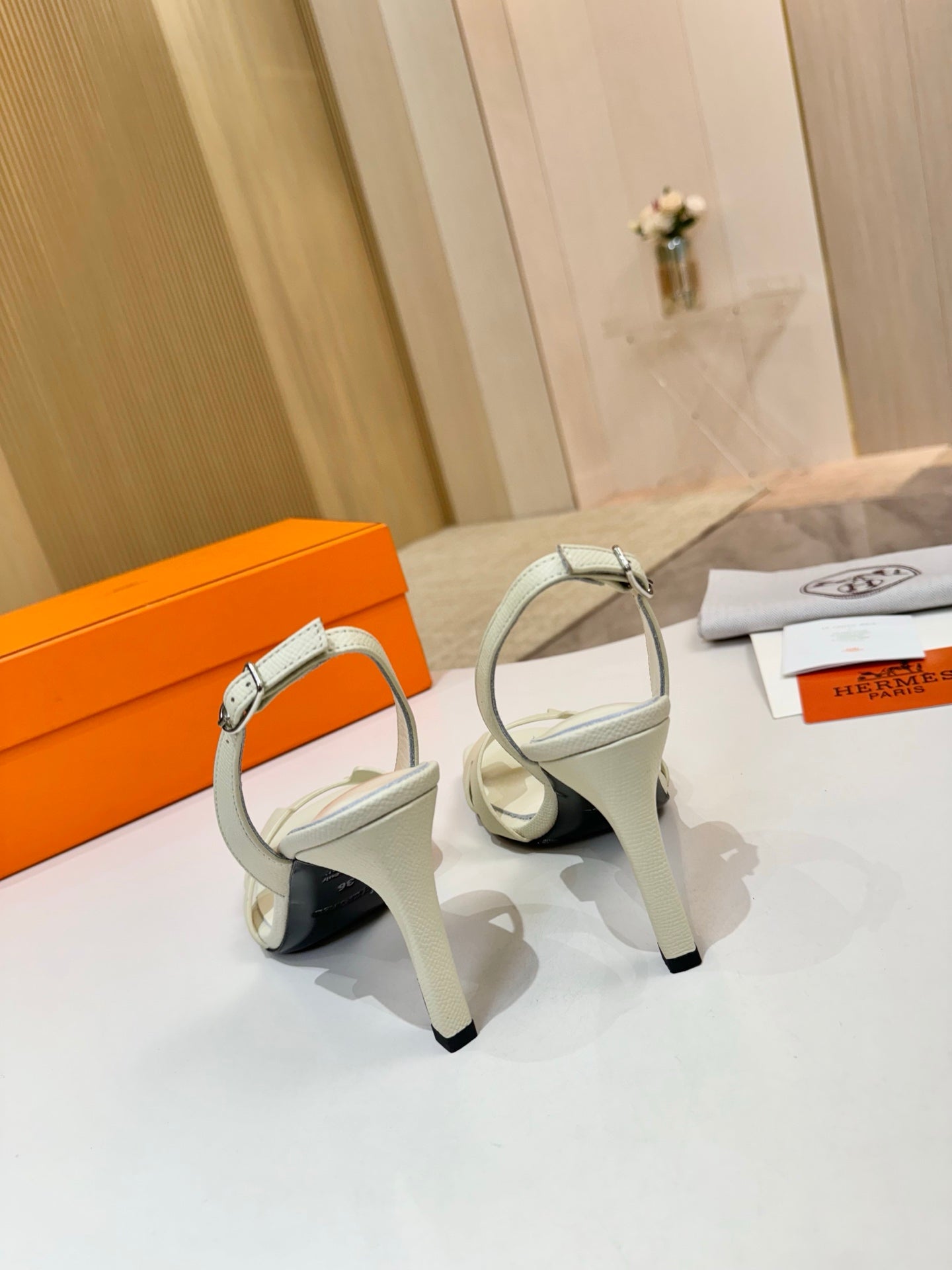 Hermes ladies heeled sandals in light cream leather with ankle strap and black high heel