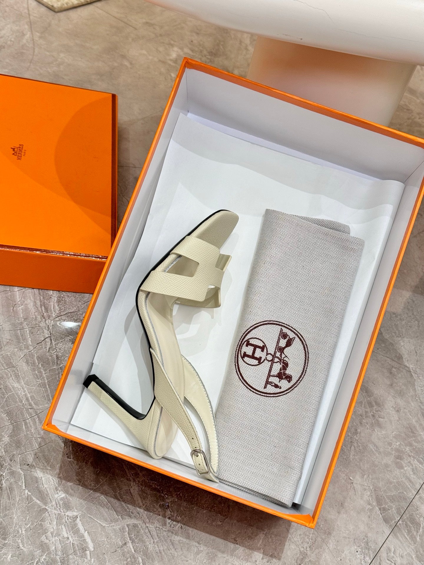 Hermes ladies heeled sandals in light cream leather, shown with dust bag in box