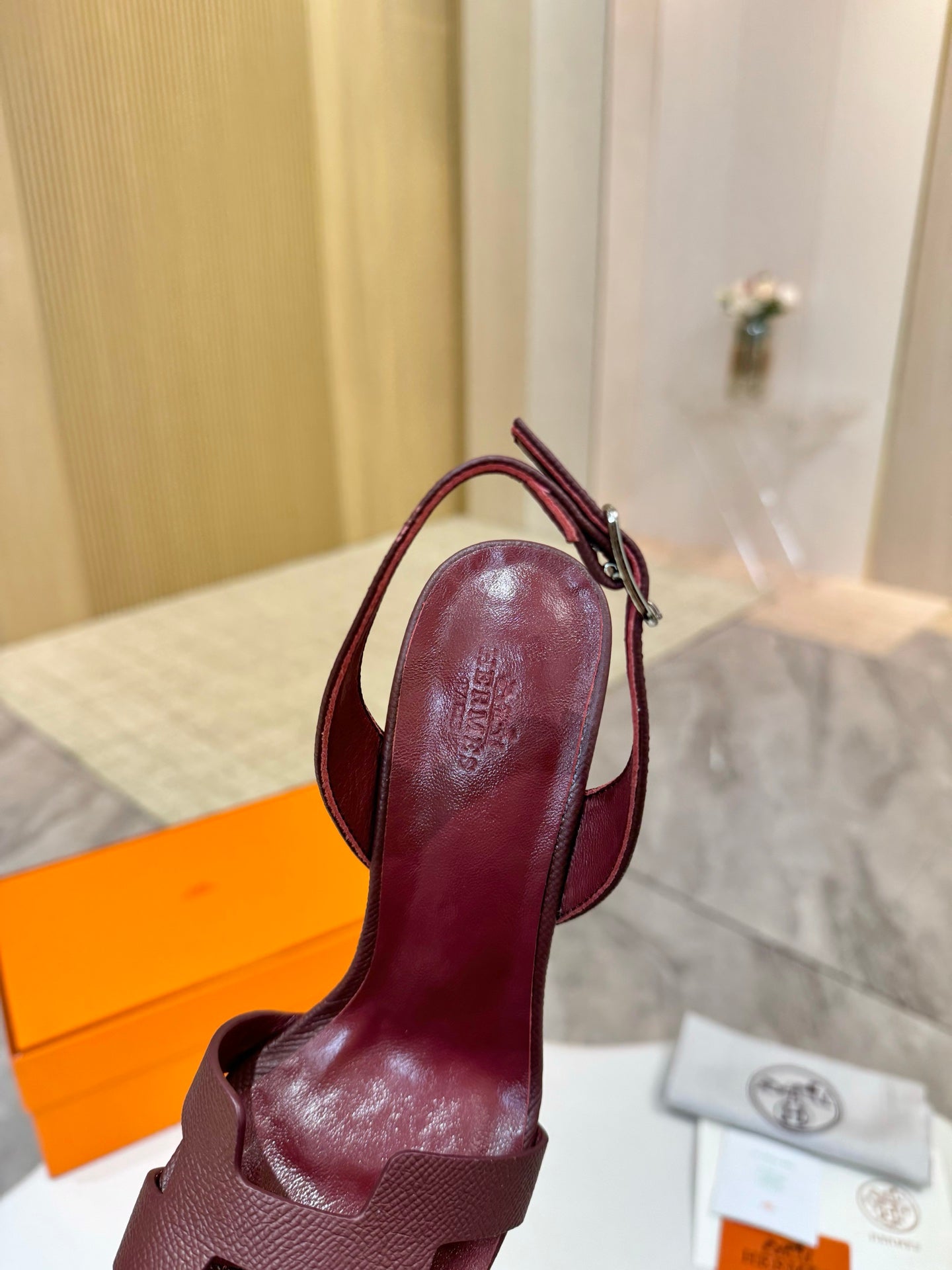 Hermes ladies' leather heeled sandals in dark burgundy, open toe with ankle strap buckle.