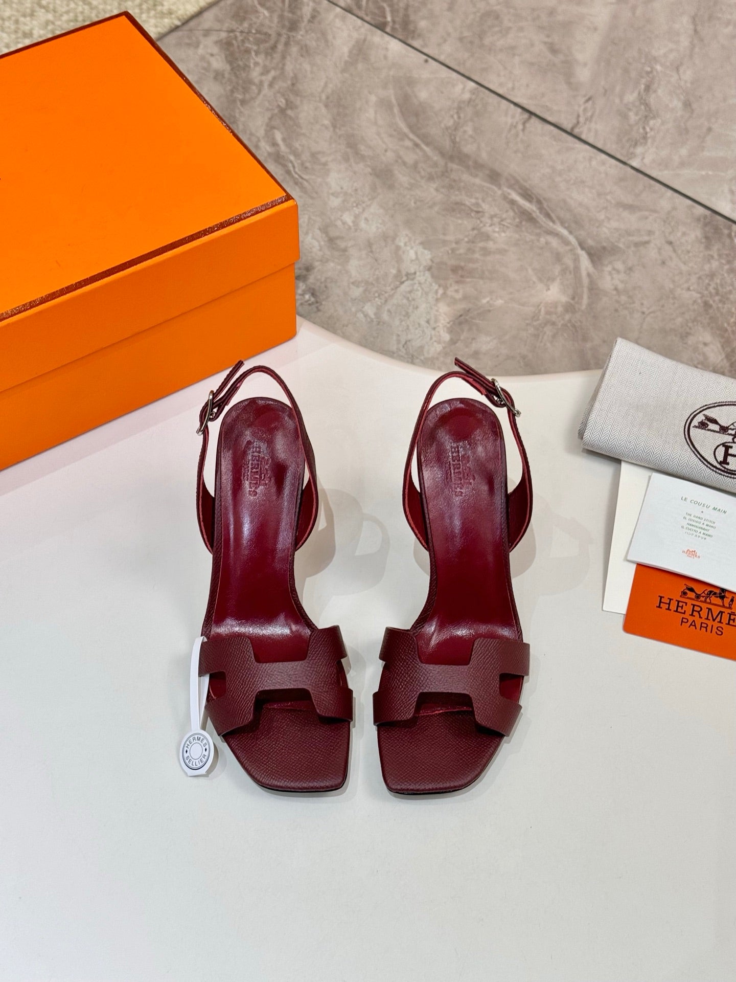 Hermes ladies' leather heeled sandals in dark burgundy, open toe T-strap, pair view.