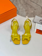 Hermes yellow leather heeled sandals with ankle strap and open-toe front