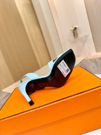 Hermes light blue heeled sandal showing inner label and outsole