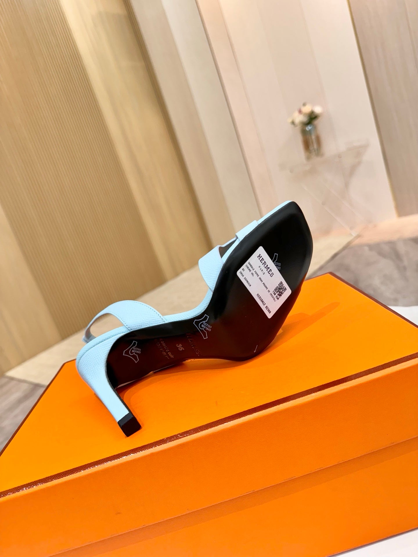 Hermes light blue heeled sandal showing inner label and outsole