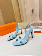 Hermes light blue leather heeled sandals with slingback strap and strap details