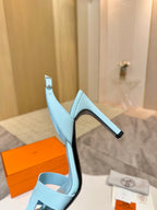 Hermes light blue leather heeled sandal with slingback strap and slim black heel