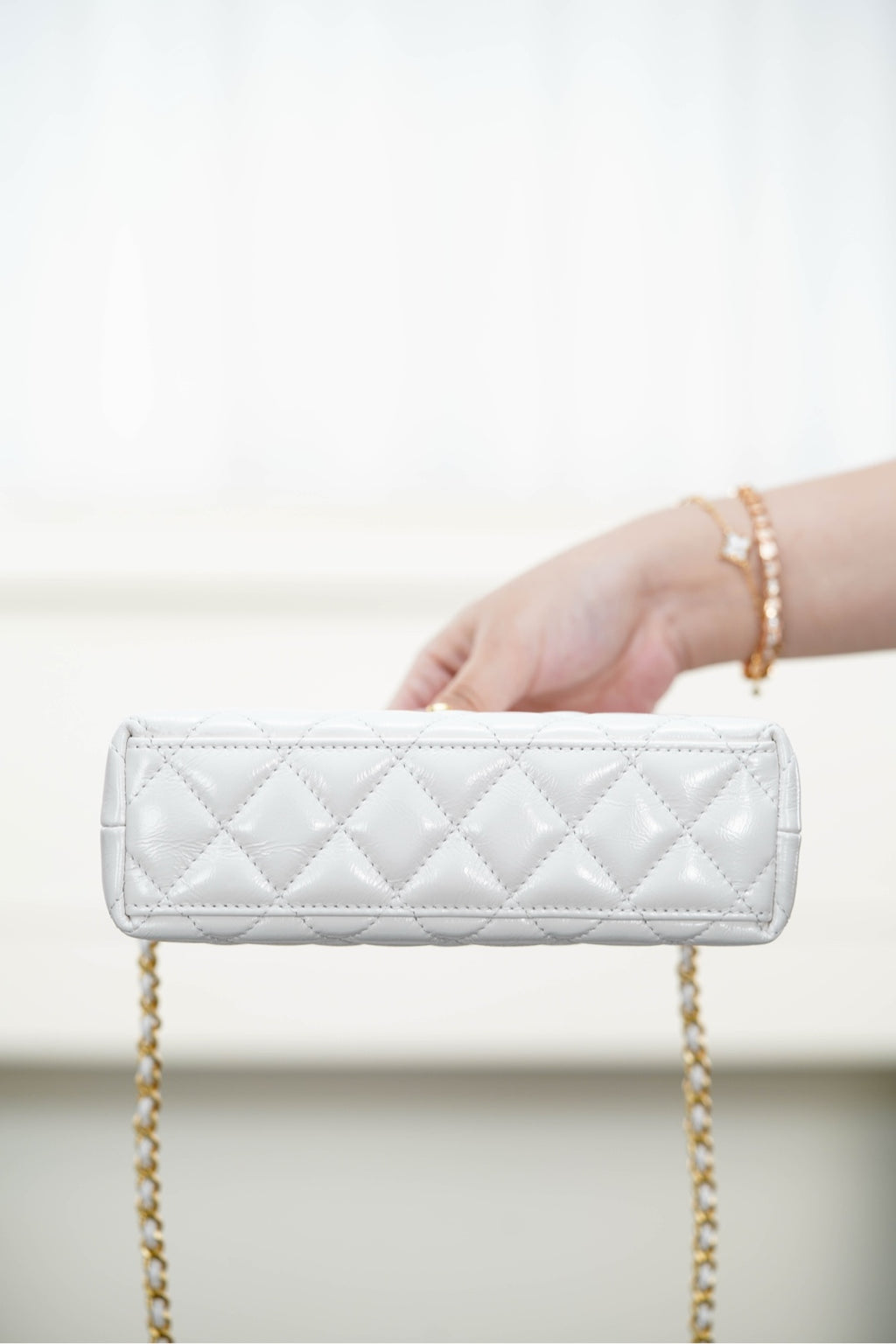 Chanel quilted wallet-on-chain with gold chain strap and clasp top