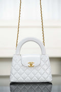 Chanel quilted handbag with top handle, gold chain strap and flap closure