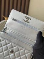 Silver Chanel interior pocket with CC logo and zipper pocket