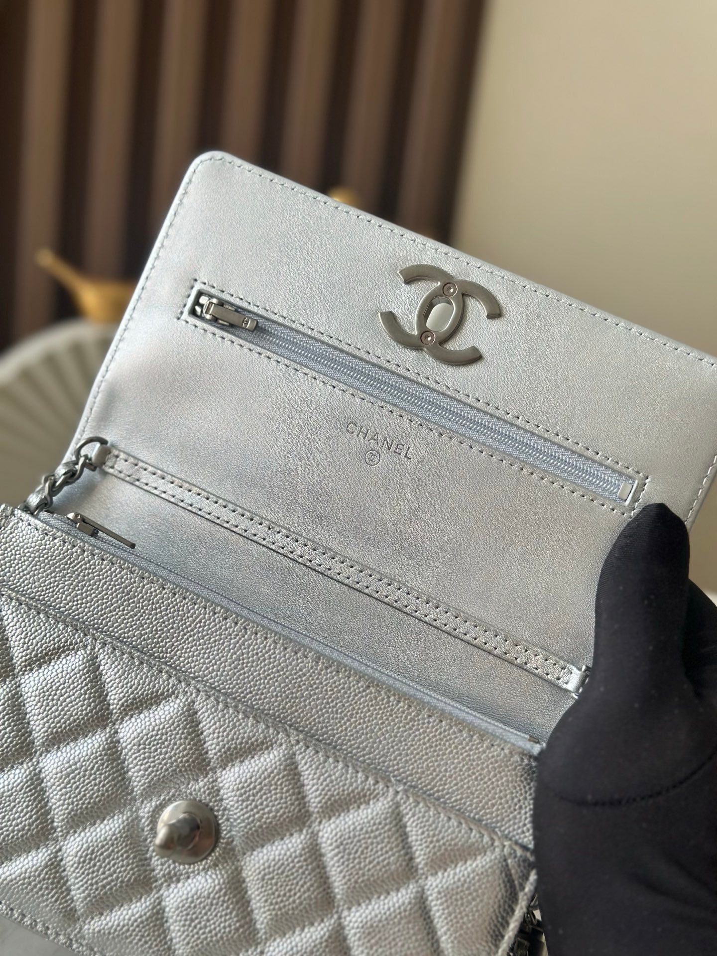 Silver Chanel interior pocket with CC logo and zipper pocket