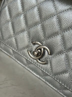 Silver Chanel CC logo clasp on quilted bag flap