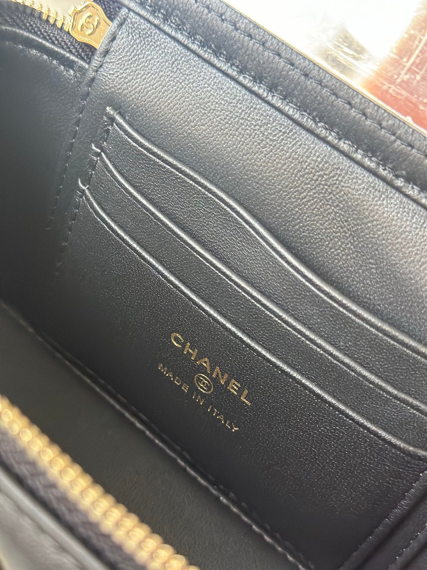 Black leather interior with Chanel logo label and stitched card slot