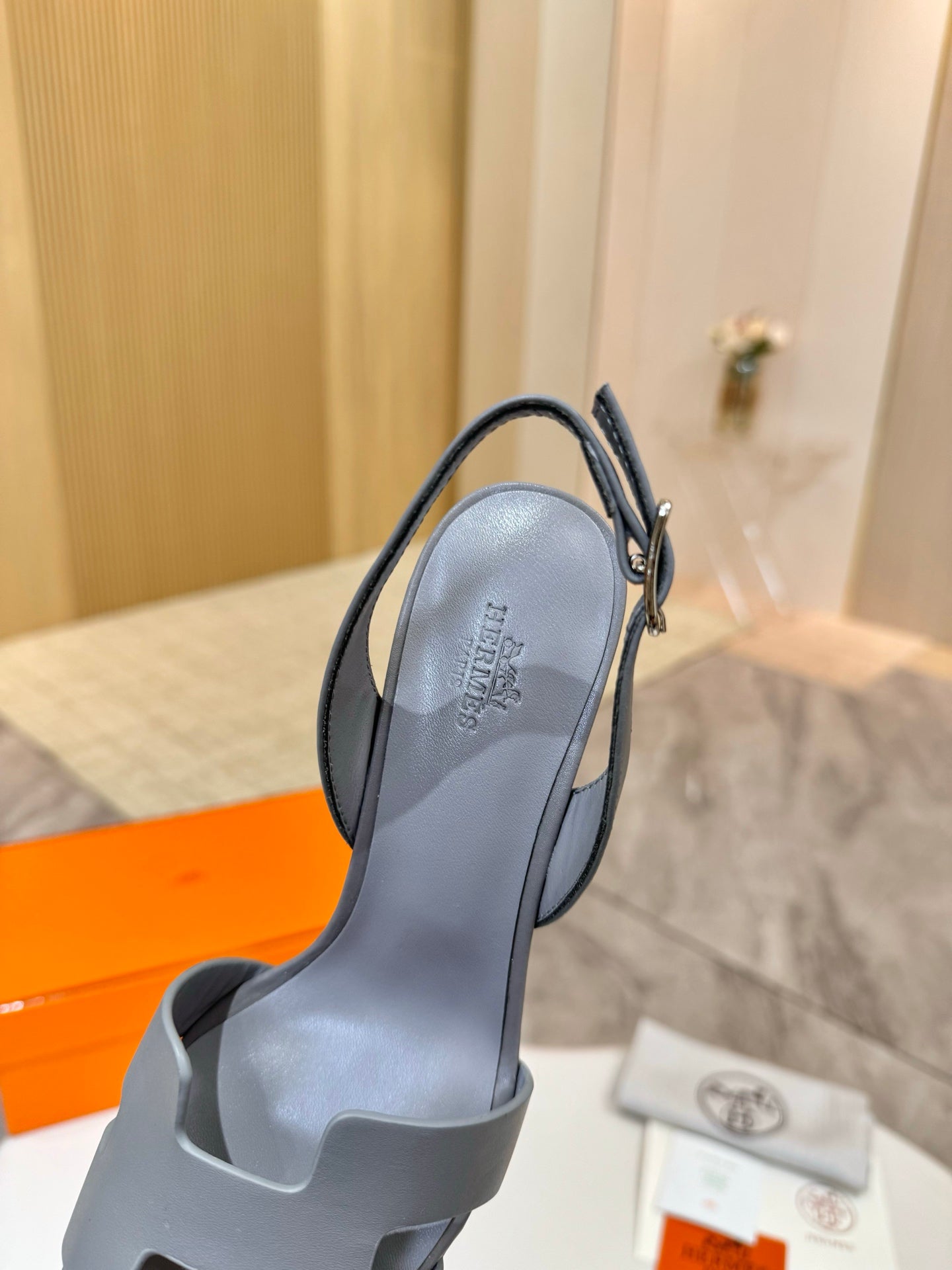 Light blue leather heeled sandal, front profile with slingback ankle strap