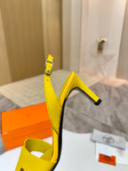 Hermes yellow leather slingback sandals close-up of ankle strap and high block heel