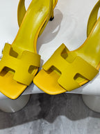 Hermes yellow leather slingback sandals close-up of cutout vamp and block heel