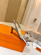 Hermes ladies heeled sandal in light beige with slingback strap and cutout details
