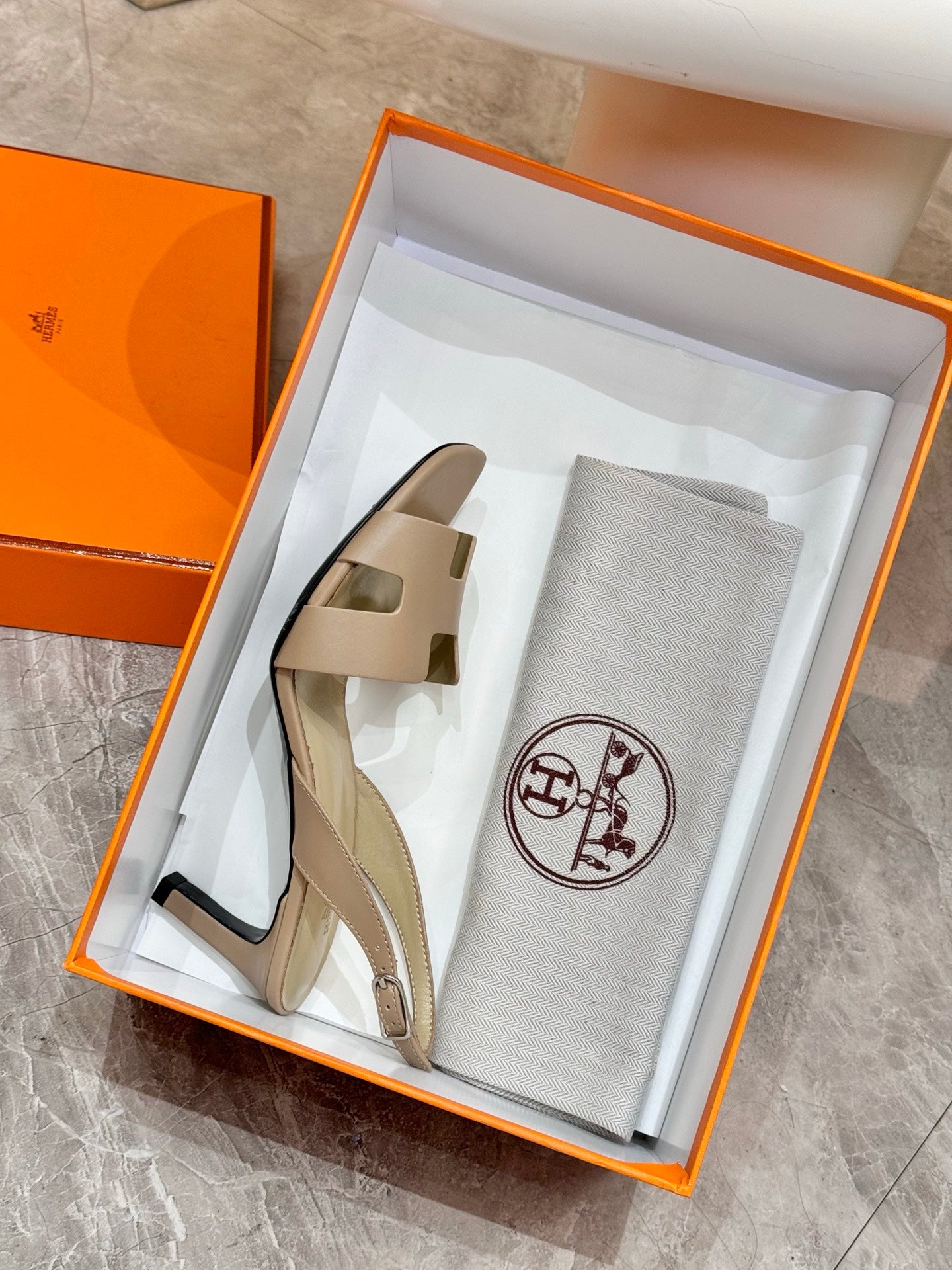 Hermes ladies heeled sandals in light beige, shown in gift box with dust bag