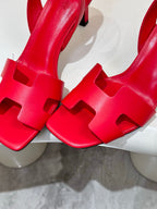 Hermes ladies red leather high-heel sandals close-up of cutout front straps