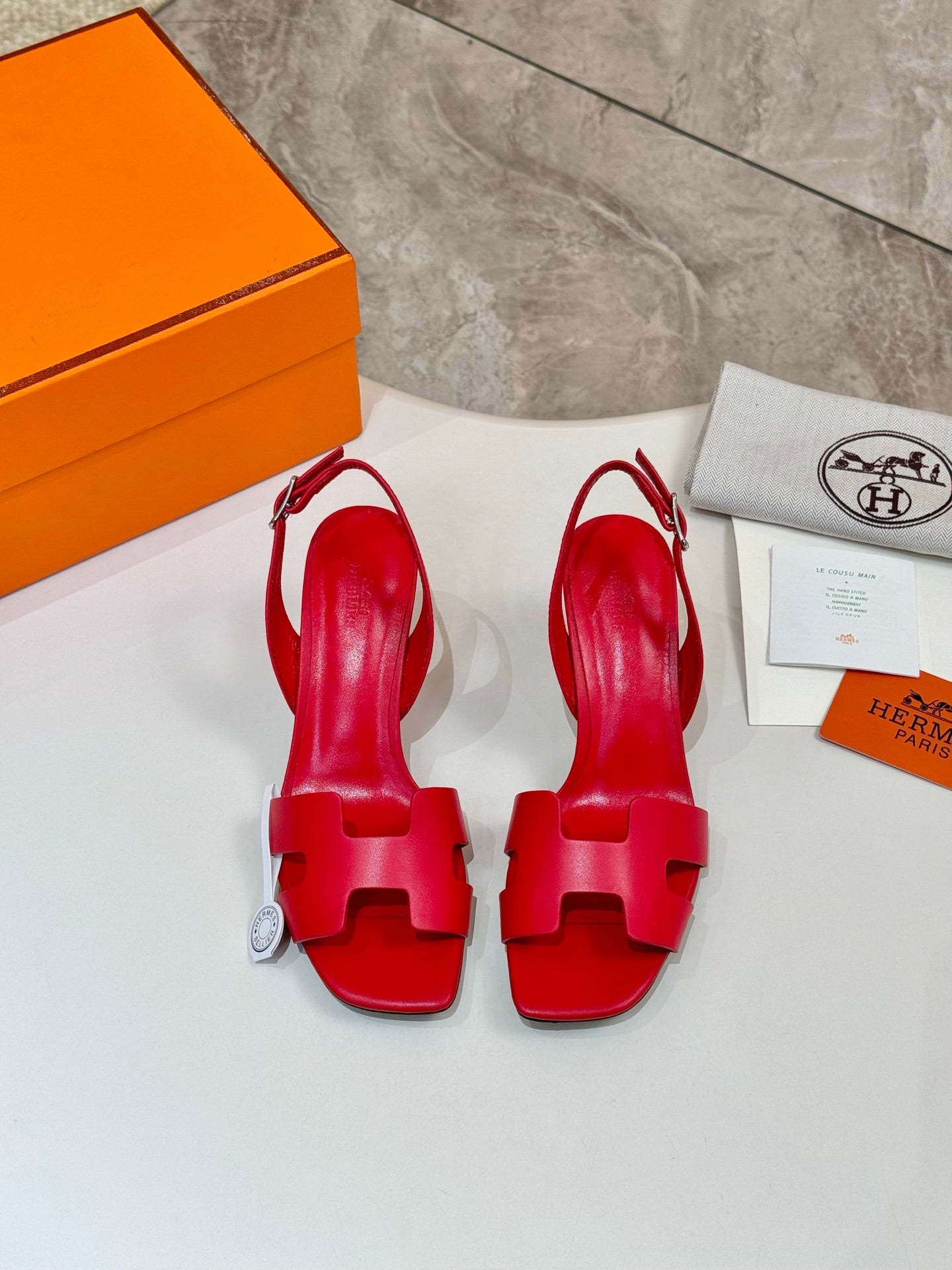 Hermes ladies red leather high-heel sandals back view with orange packaging
