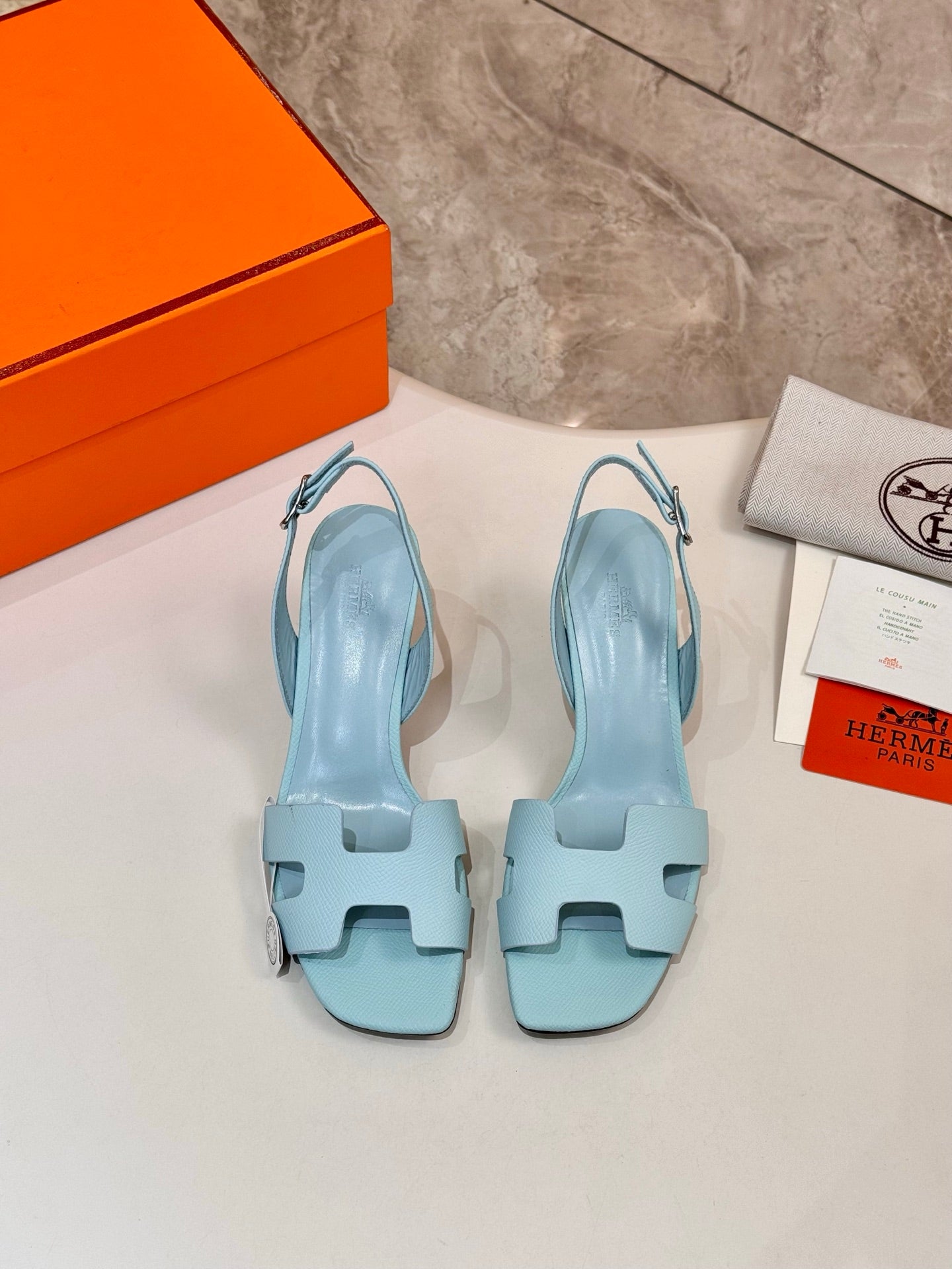 Pair of Hermes light blue open-toe heeled sandals with ankle strap and straps
