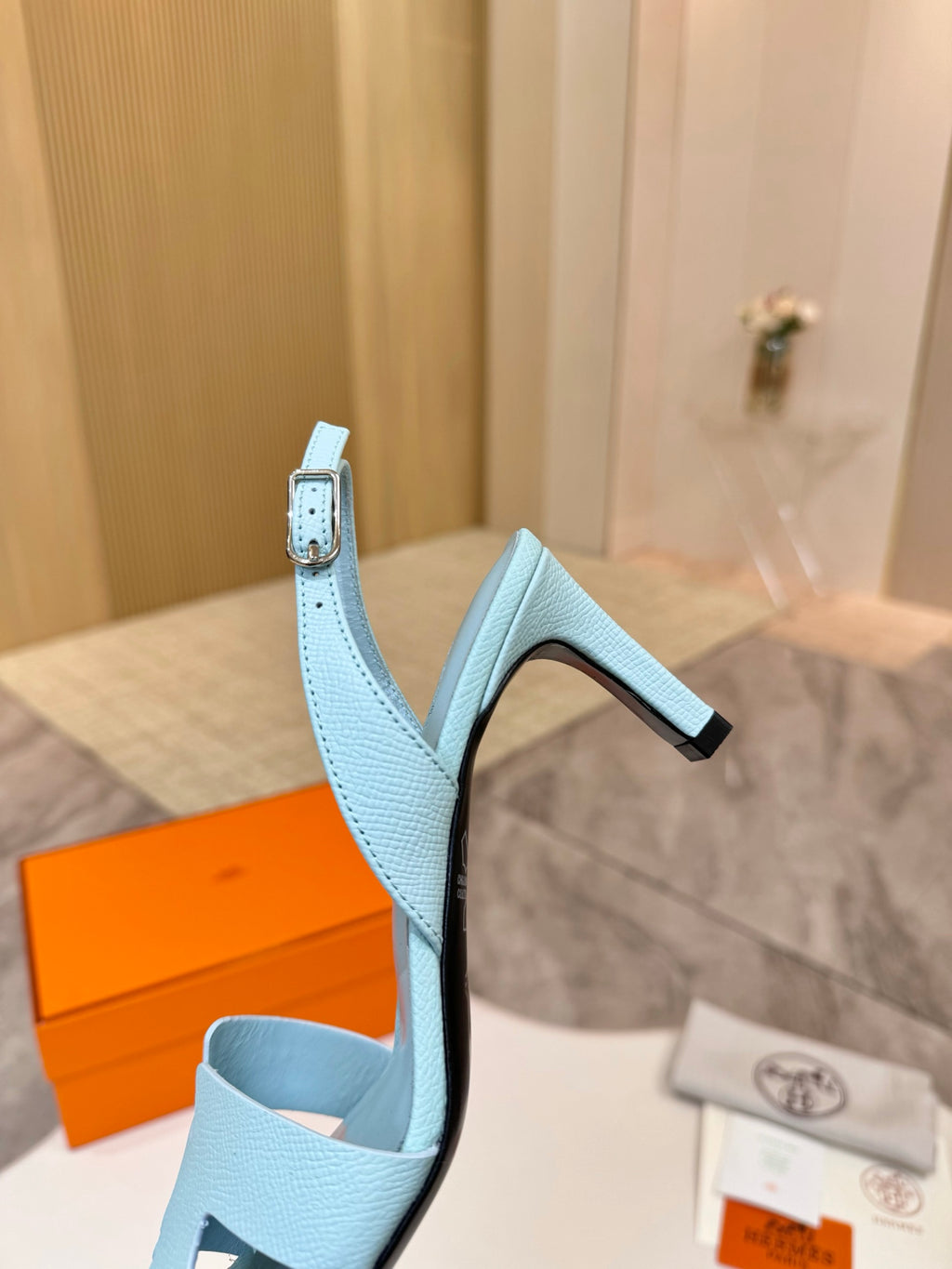 Hermes light blue heeled sandal with T-strap front and sculpted block heel