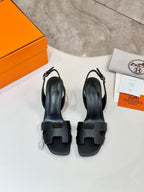 Pair of Hermes black slingback sandals with blocky straps and open toe