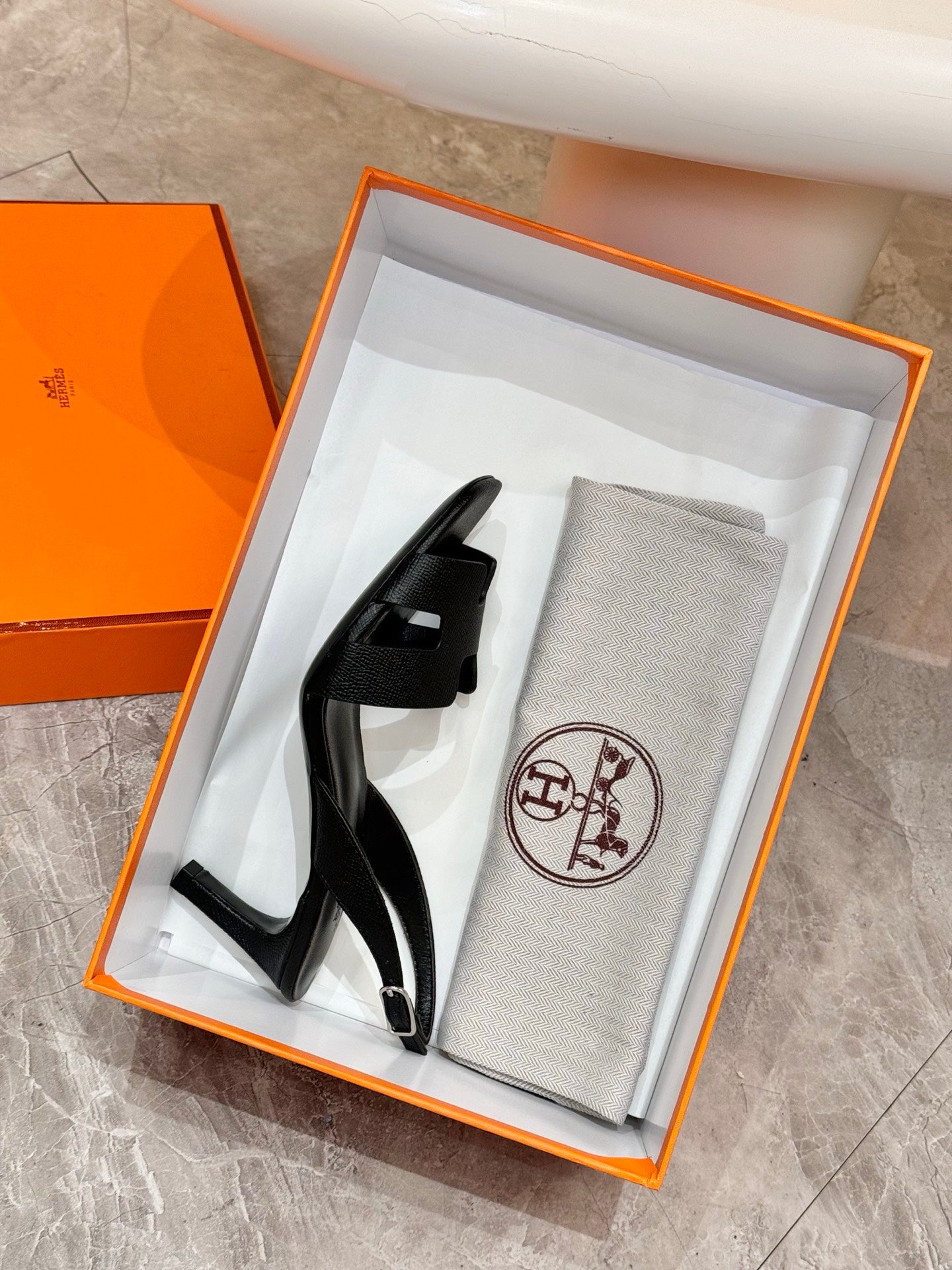 Hermes black leather slingback sandals in an orange gift box