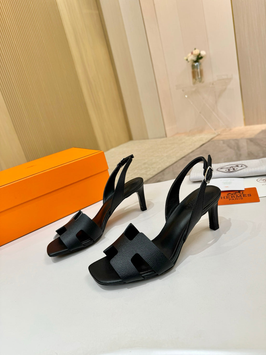 Hermes black pebbled leather slingback sandals with ankle strap and high heel