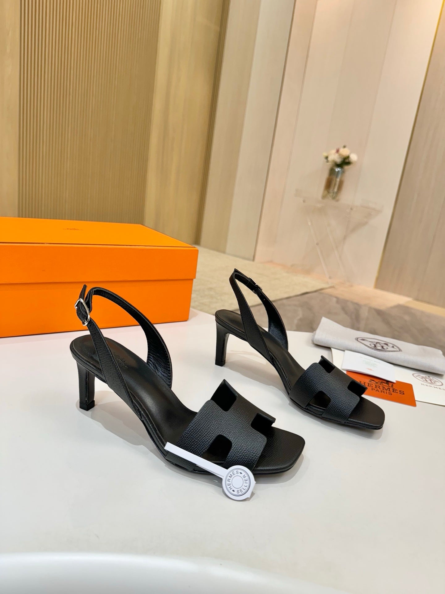 Hermes black pebbled leather slingback sandals with open toe and slim heel