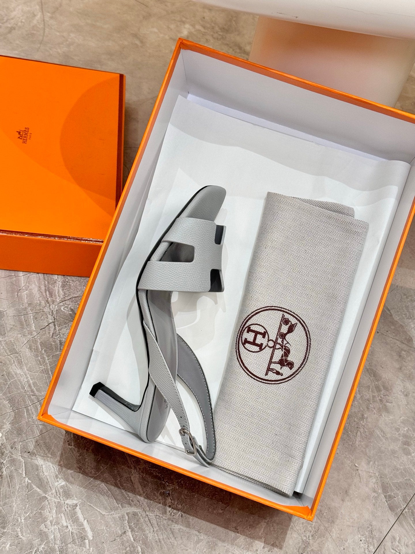 Light blue slingback heeled sandals in orange gift box with dust bag