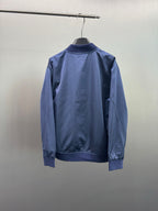 Dark blue bomber jacket back view with ribbed cuffs and stand collar