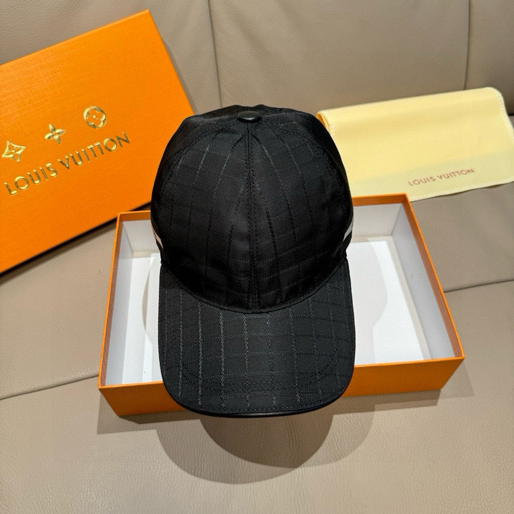 Black baseball cap with quilted grid pattern and curved brim, top seam detail