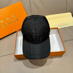 Black baseball cap with quilted grid pattern and curved brim, top seam detail