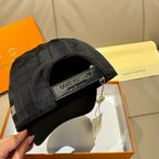 Black baseball cap with front logo band, open crown, and hanging price tag