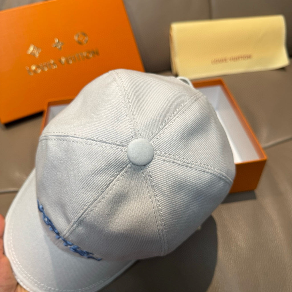 Louis Vuitton light blue cap with round top button and blue logo embroidery