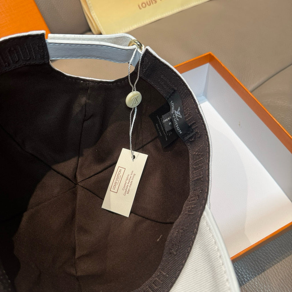 Louis Vuitton black cap with adjustable strap and hanging tag, inside view
