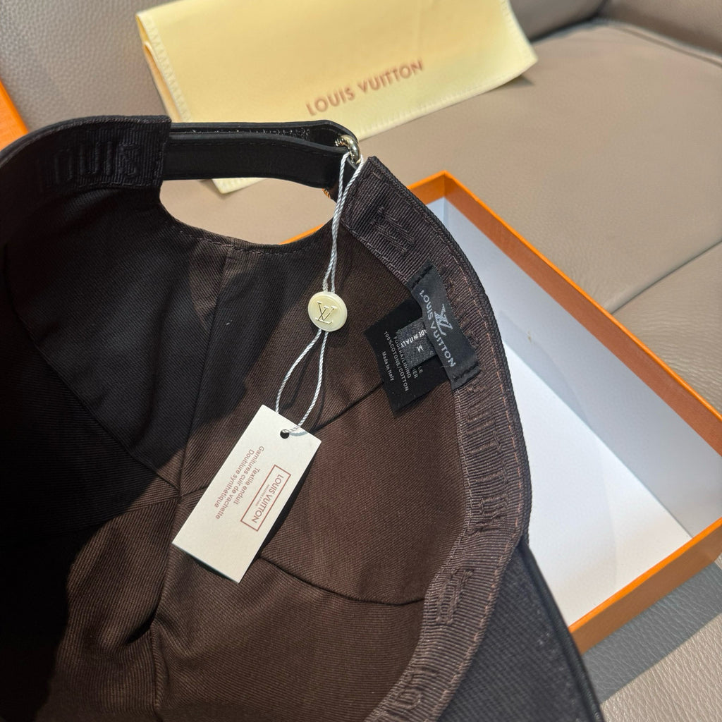 Black Louis Vuitton cap interior with adjustable strap and hanging tag