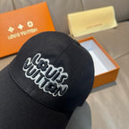 Black Louis Vuitton baseball cap close-up with embroidered script logo