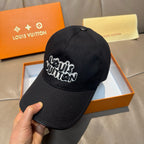Black Louis Vuitton baseball cap with embroidered script logo on front crown