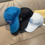 Set of three Louis Vuitton caps: blue, black, and white with embroidered logo