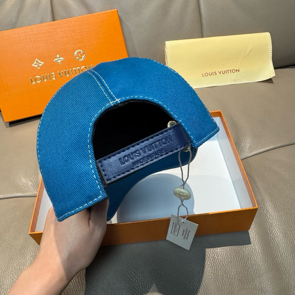 Blue denim cap interior with Louis Vuitton label on inner band and hanging tag