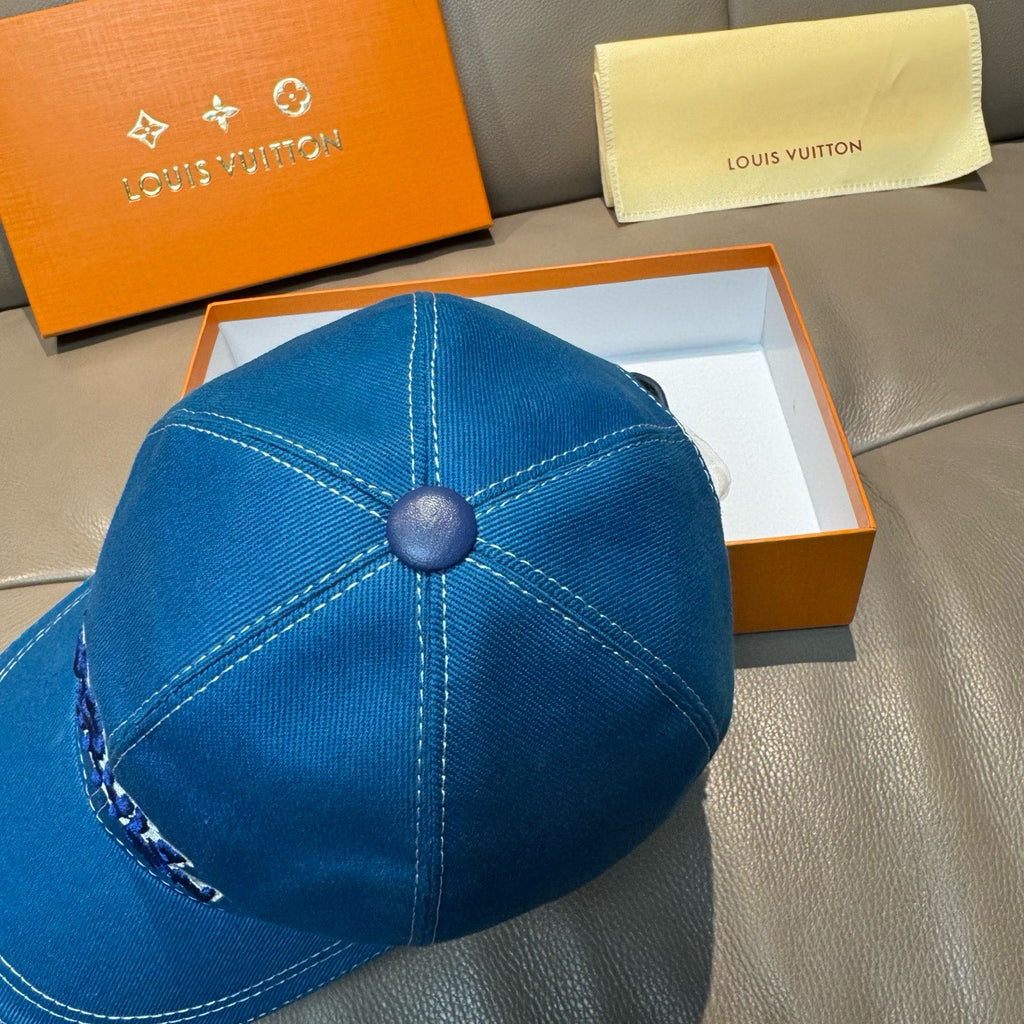 Blue denim Louis Vuitton cap back view with stitched panels and round top button