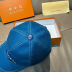 Blue denim Louis Vuitton cap back view with stitched panels and round top button
