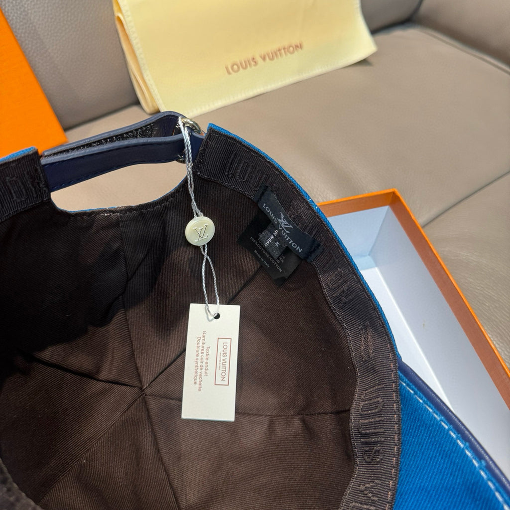 Blue denim cap interior with dark inner band and hanging care tags