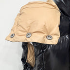 Moncler long puffer jacket with beige hood lining and dark quilted body, side view